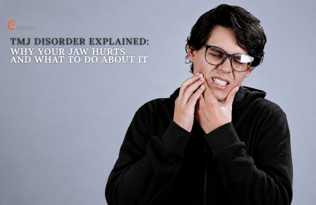 Man holding his jaw in pain from TMJ disorder at C Dental Clinic Sharjah