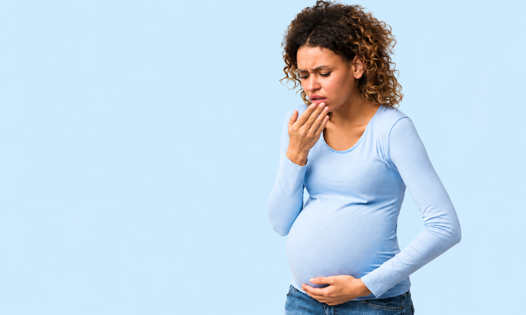 Pregnant woman touching her mouth in discomfort from bleeding gums